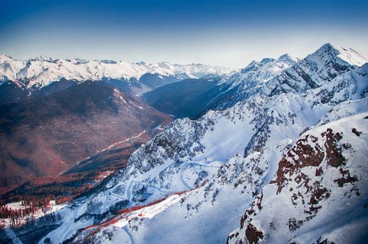 Snowboarden slopestyle mannen olympische winterspelen 2026 op een rail tijdens een sprong in de finale